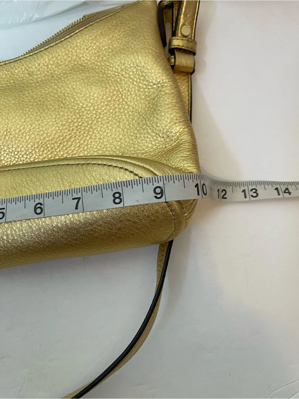 Michael Kors Gold leather hobo crossbody bag.