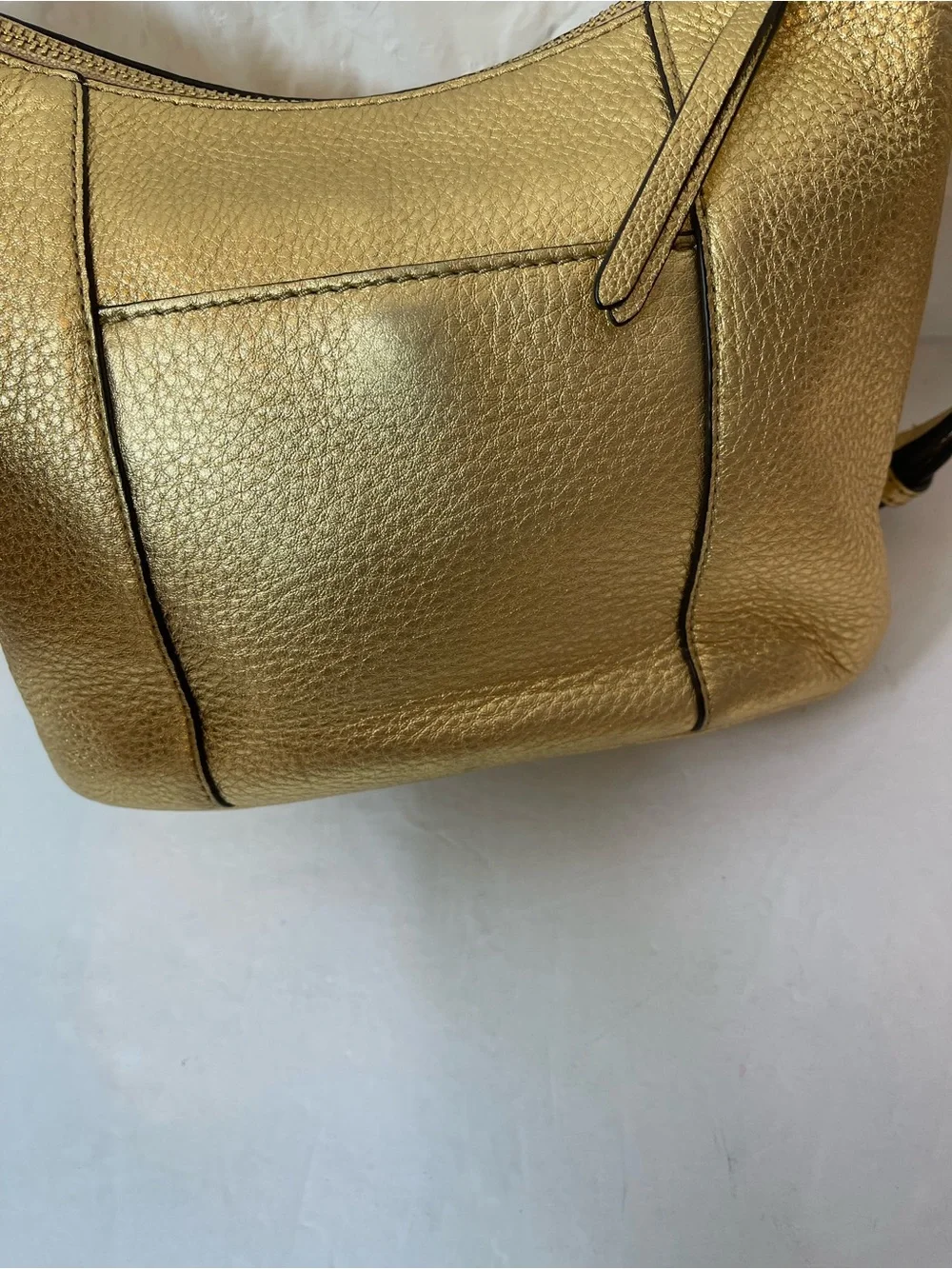 Michael Kors Gold leather hobo crossbody bag.