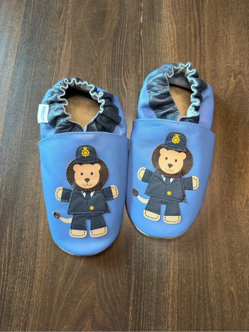 Robeez Blue Leather Baby Slip-Ons with Lion Officer Applique