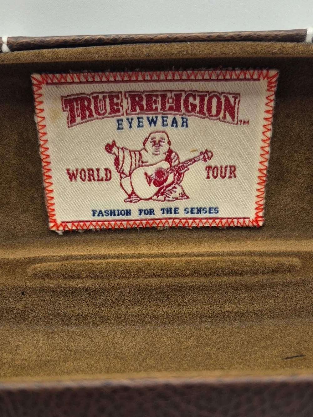 True Religion tone clamshell
