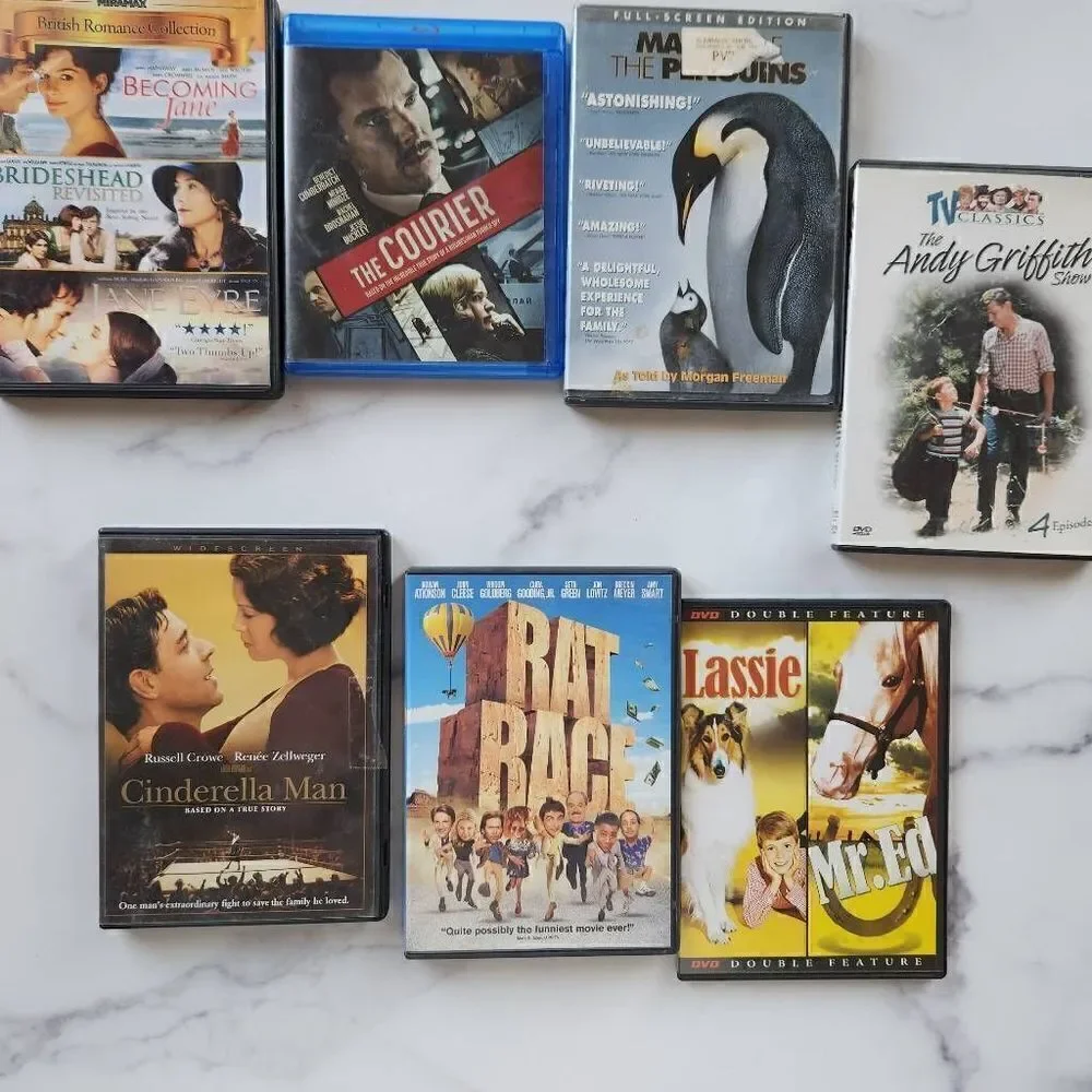 Bundle of seven empty plastic DVD cases rat race Cinderella Man lassie
