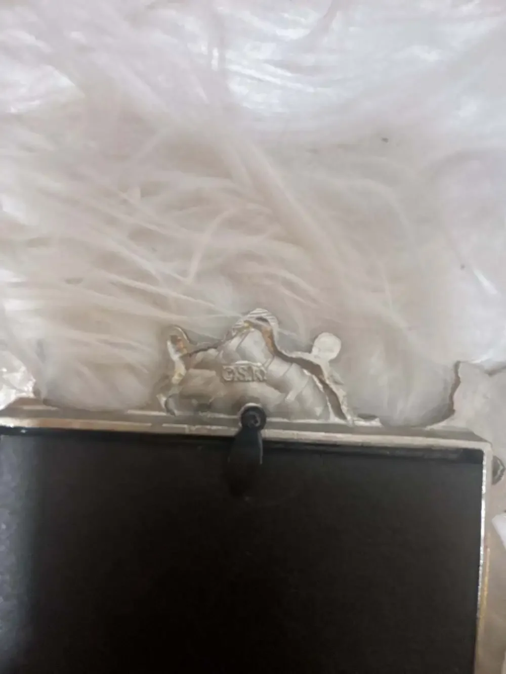 S.K. silver tone