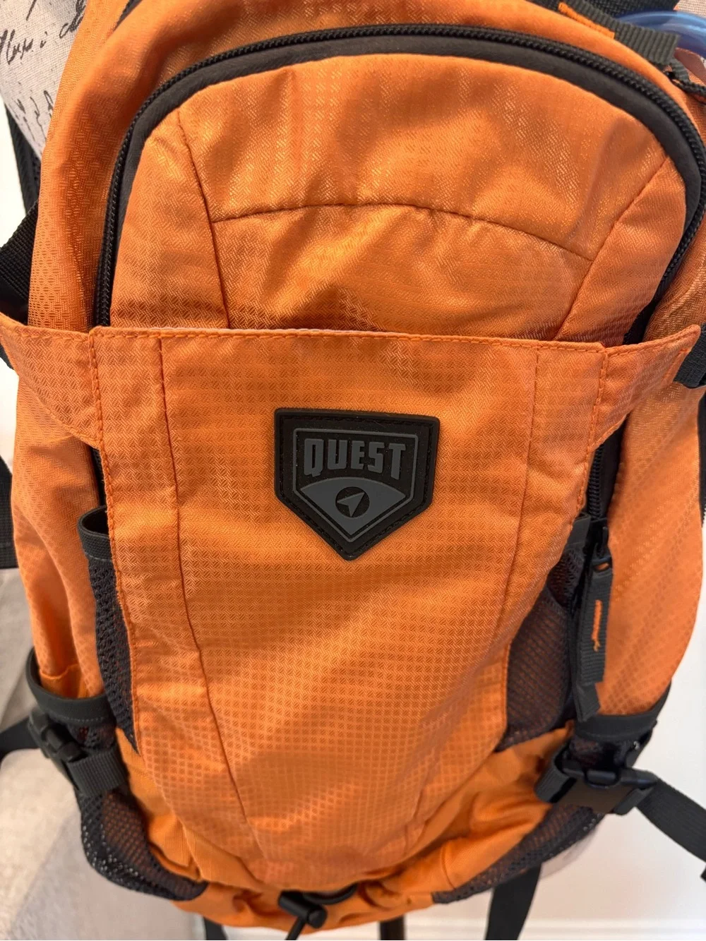 Quest 2L Hydration Pack in orange with a 2-liter water bladder