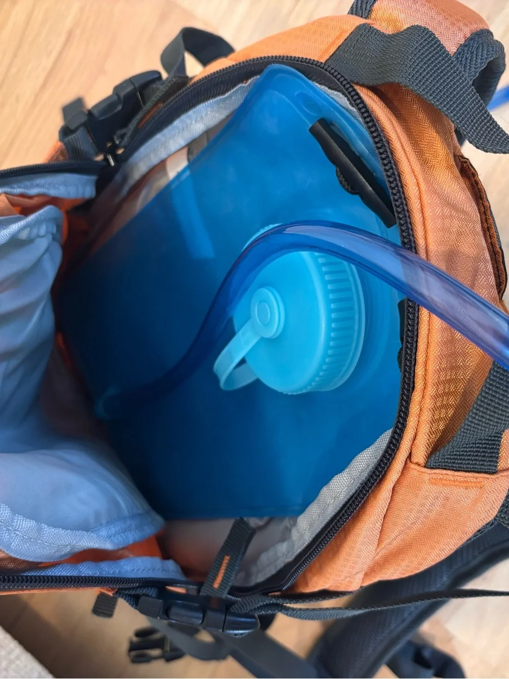 Quest 2L Hydration Pack in orange with a 2-liter water bladder