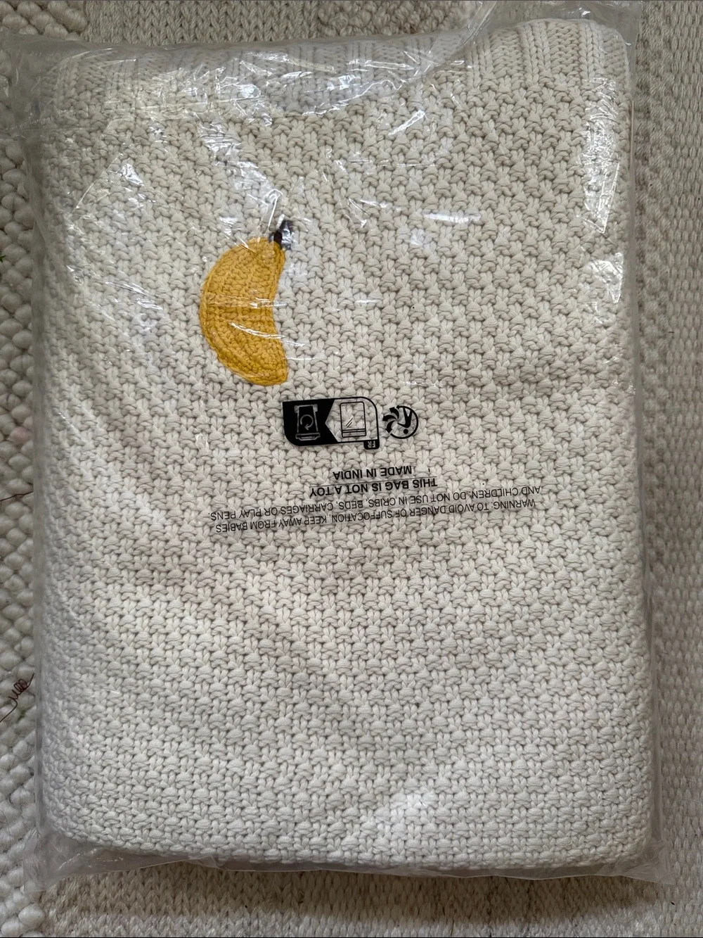 Isabella Cotton Knit Icon Banana Throw Blanket from Anthropologie