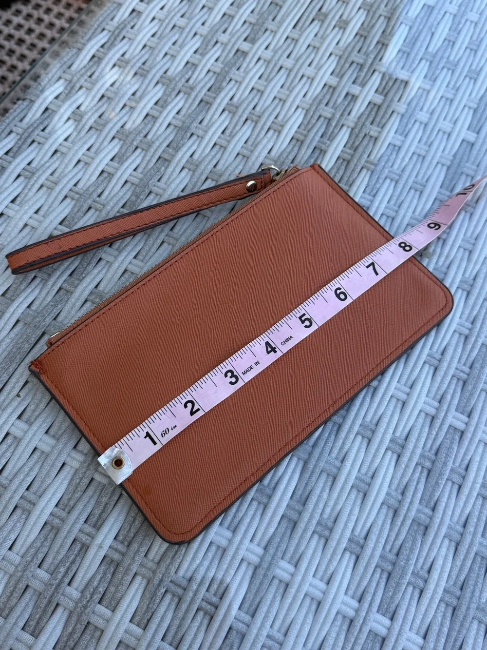 kate spade wristlet clutch in rust orange