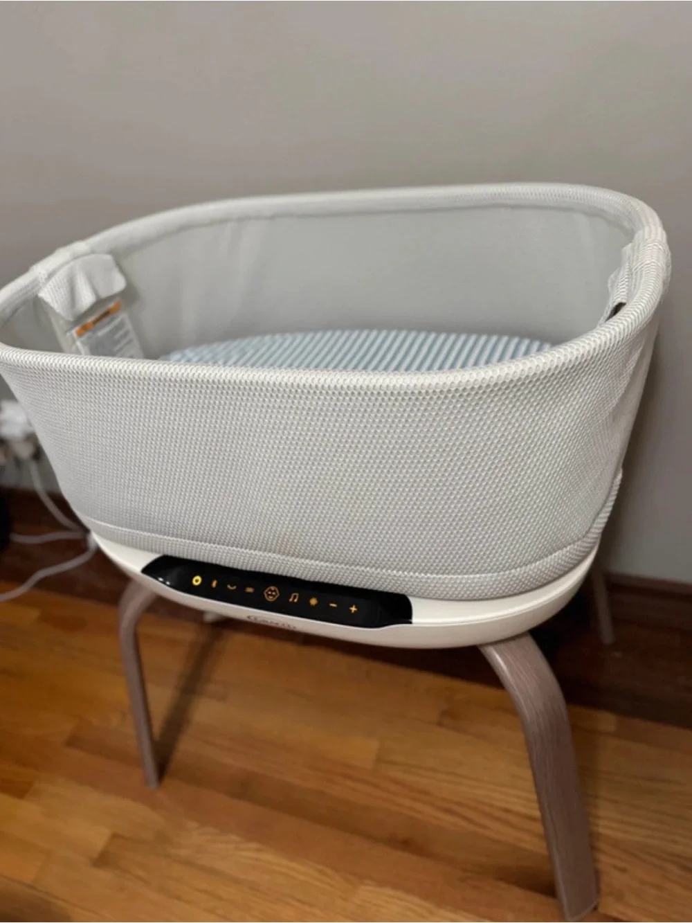 Modern White Fabric Baby Bassinet with Integrated Controls