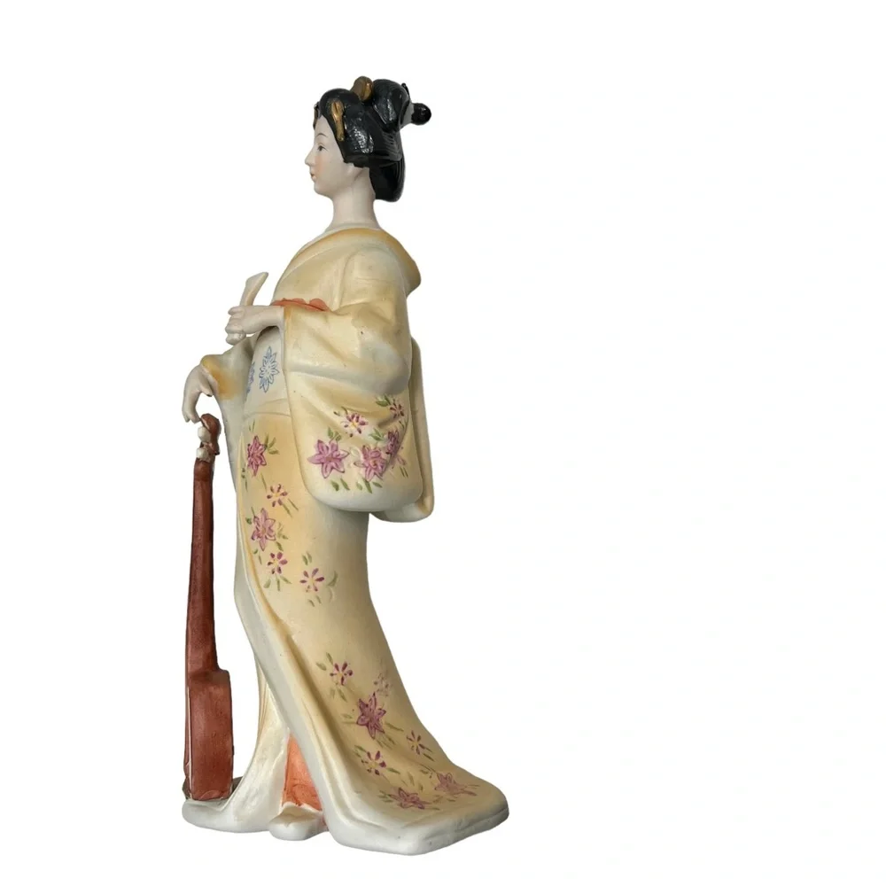 Vintage geisha holding