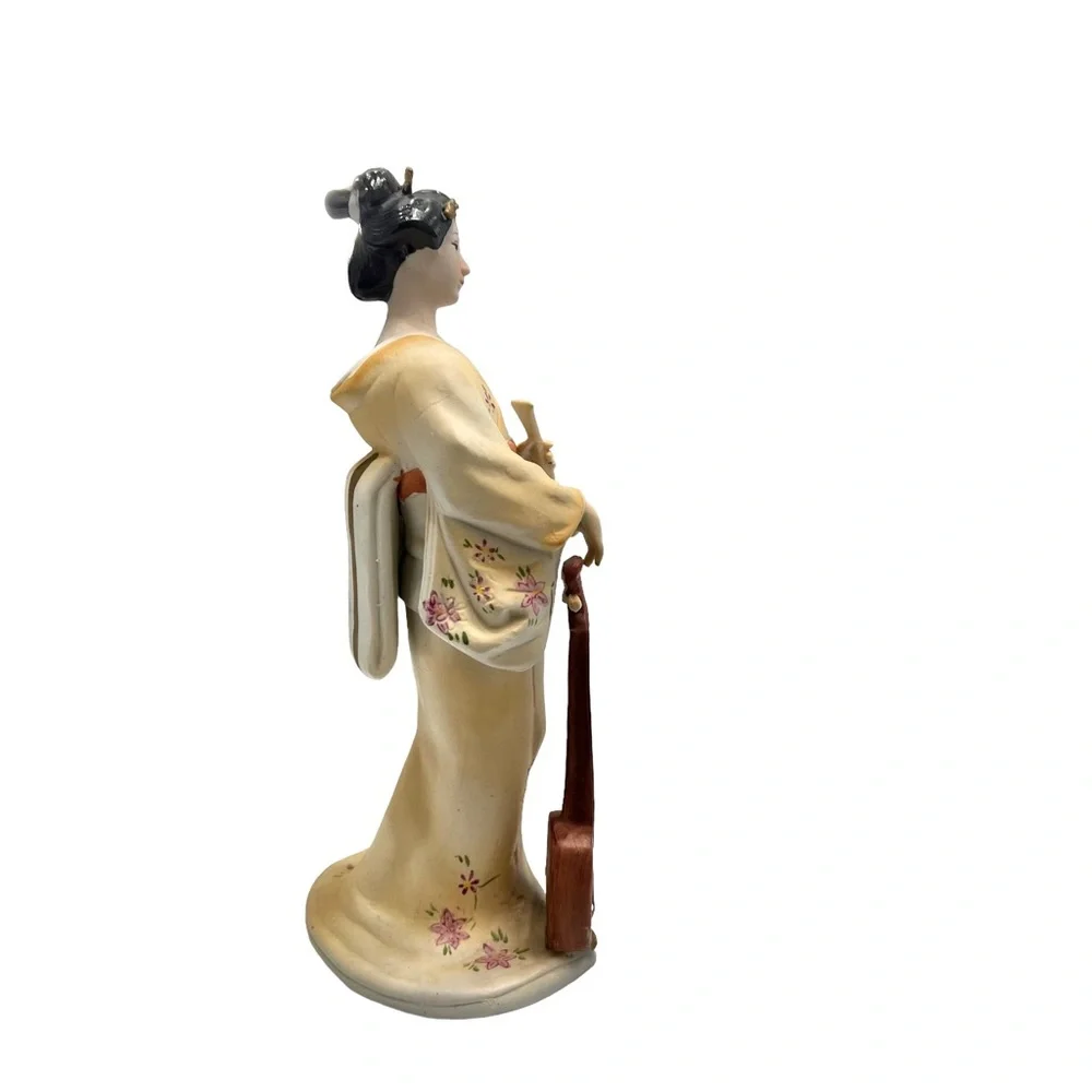 Vintage geisha holding