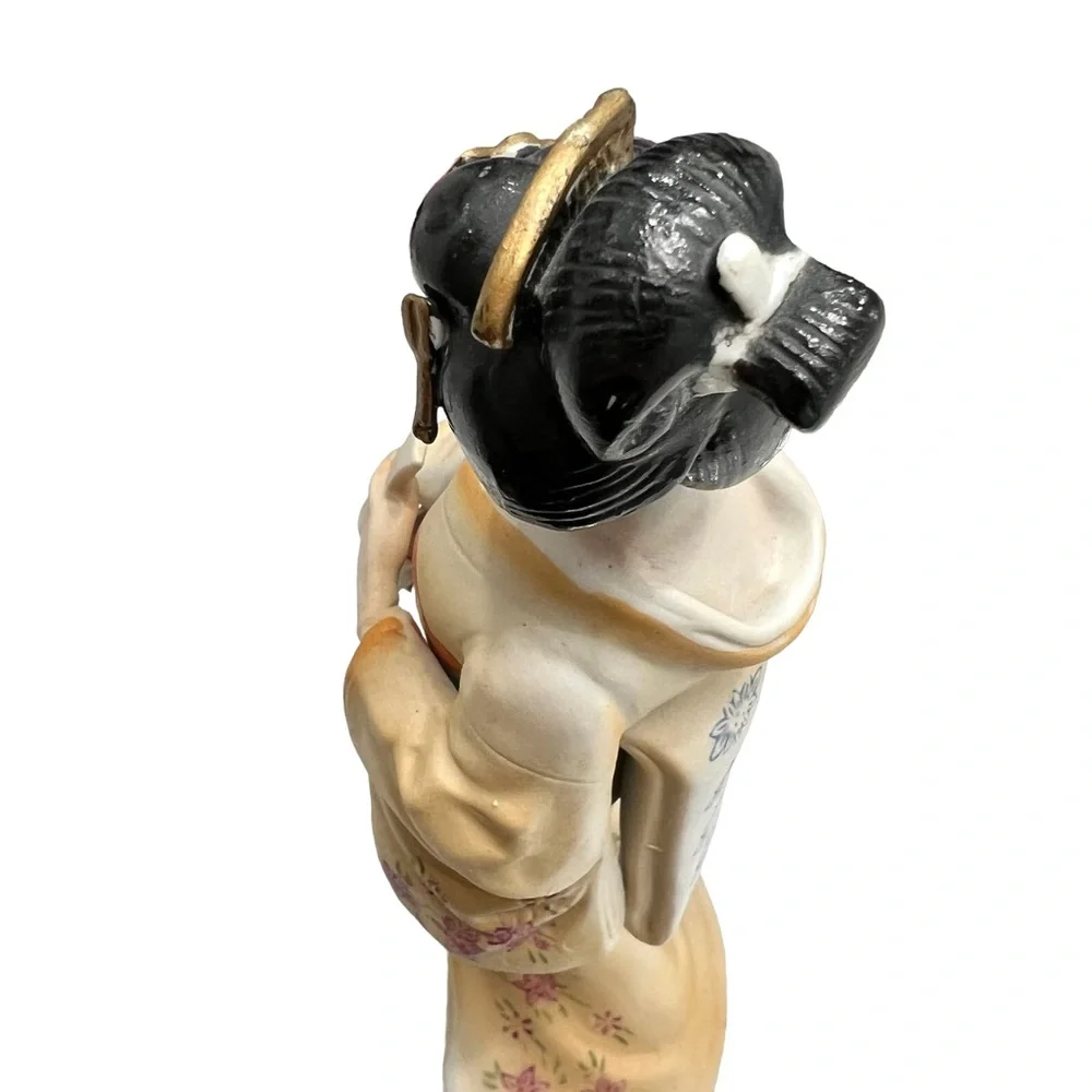 Vintage geisha holding