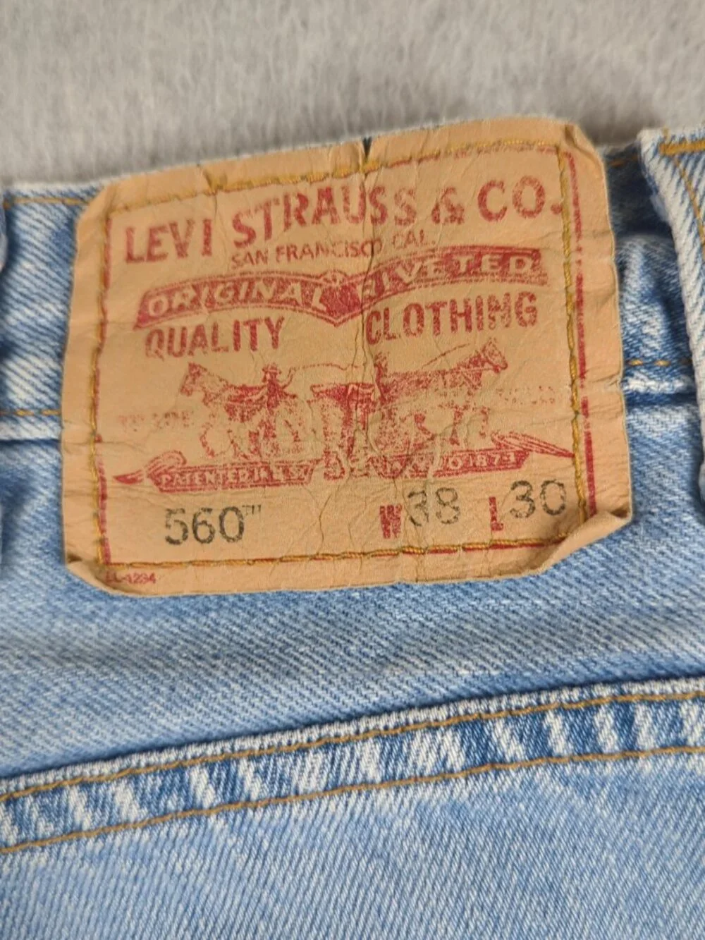 Levi's 560 Jeans Men's 38x30 Blue Comfort Fit Tapered Leg Baggy Faded Light Wash