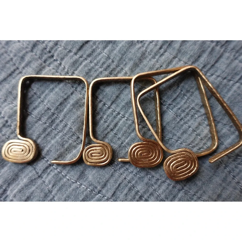 set‎ of 4 Vintage napkin rings metal brass with swirl rectangular design