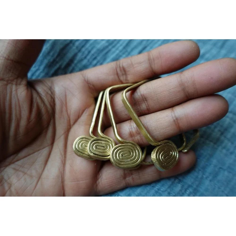set‎ of 4 Vintage napkin rings metal brass with swirl rectangular design