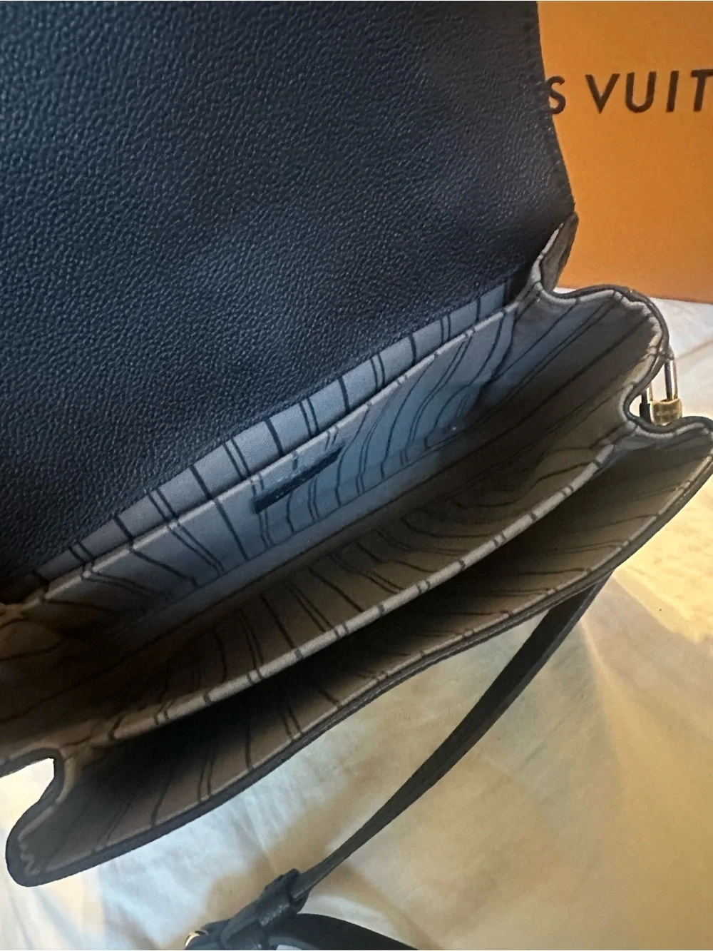 Louis Vuitton compact embossed