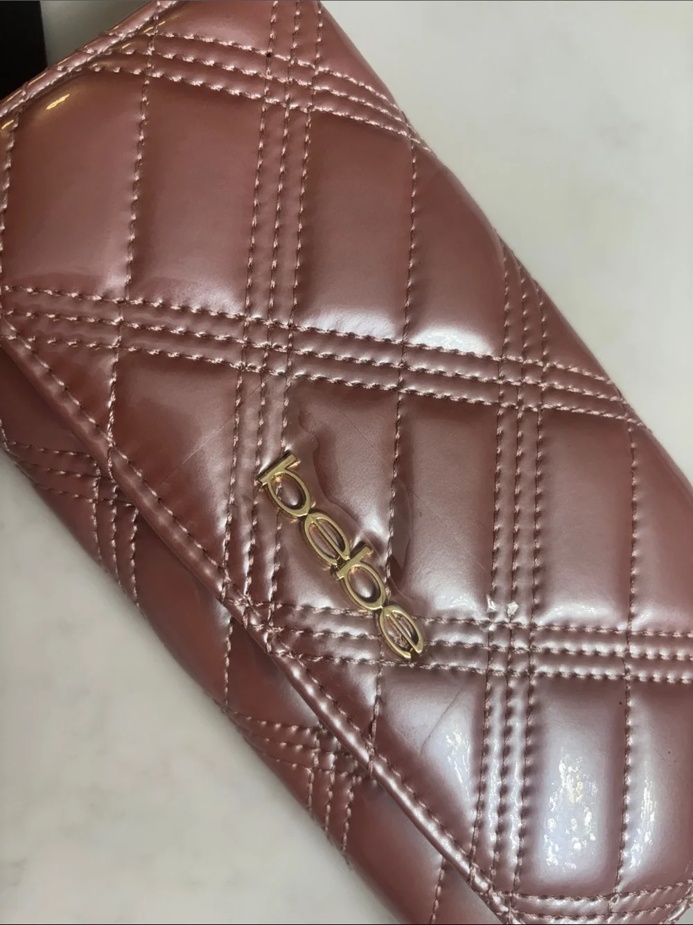 bebe Quilted Clutch in Mauve Brown with Gold Hardware