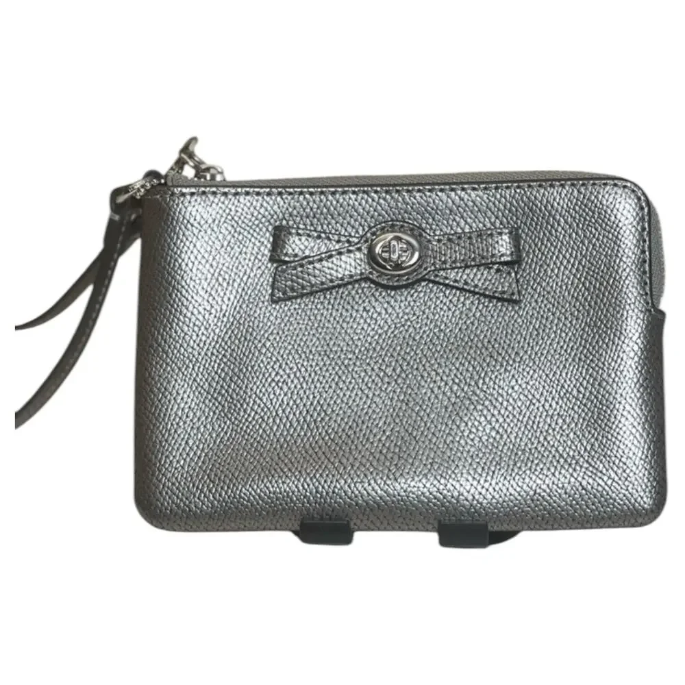 EUC Coach Metallic Silver Wristlet with Bow Detail